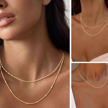 Ingrid – Elegantt lagerat halsband i guld med mönstrade kedjor