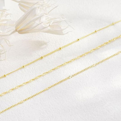 Ingrid – Elegantt lagerat halsband i guld med mönstrade kedjor